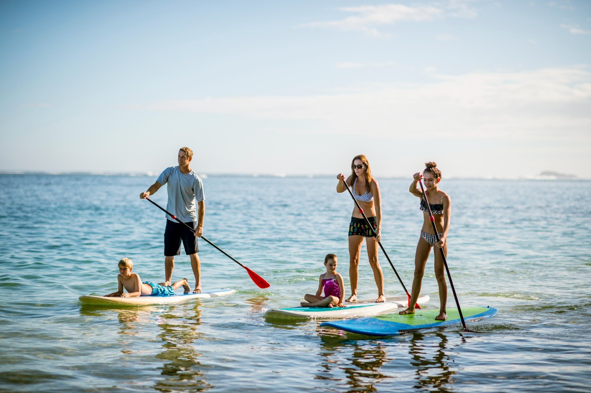 family on paddleboard