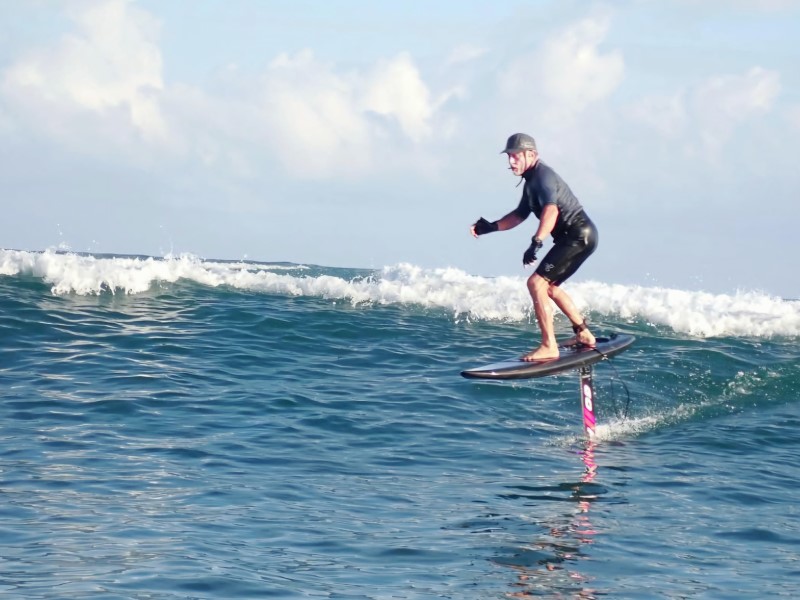 man surfing on the wave